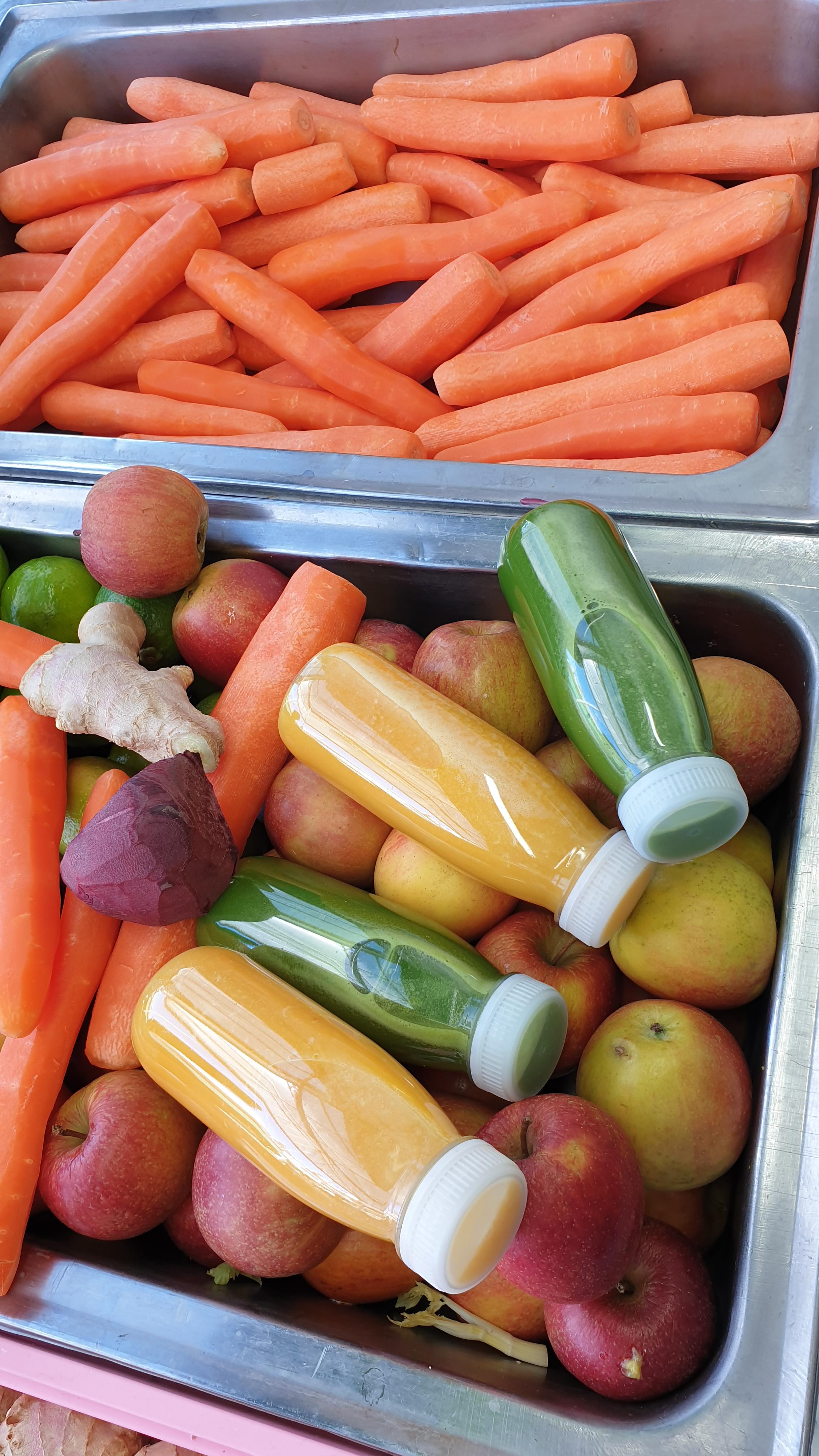 Fresh Osman Juices - Orange and Green bottles with fresh ingredients